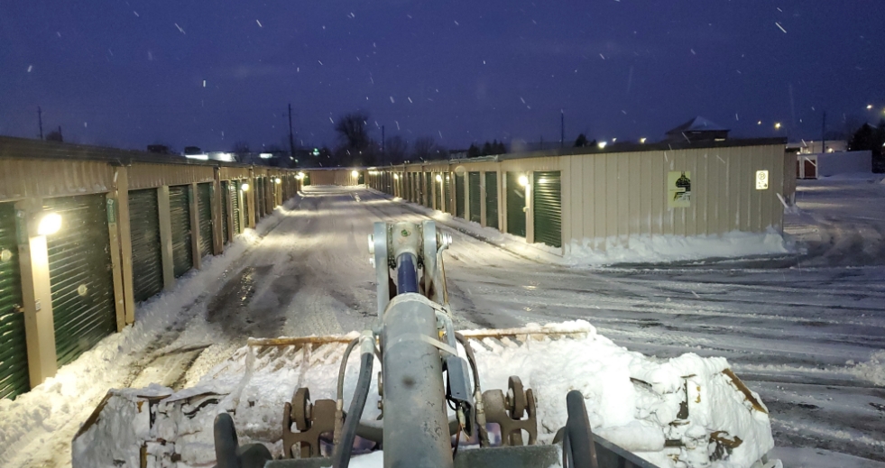 The drivers view from a tractor working on commercial snow removal in Barrie at a storage facility