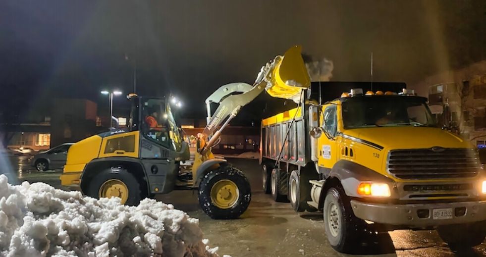 Snow hauling by a professional snow removal company