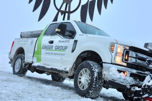 Ainger commercial snow plow truck operating during winter in Barrie Ontario