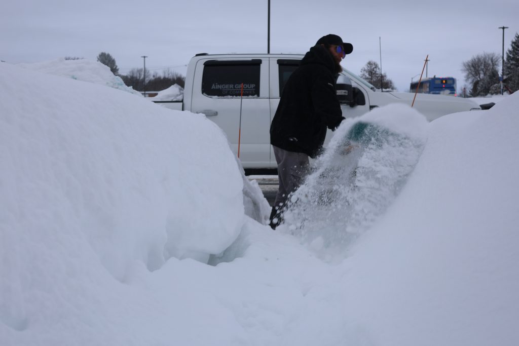 Ainger Snow Removal crew clearing deep snow for a commercial property in Collingwood