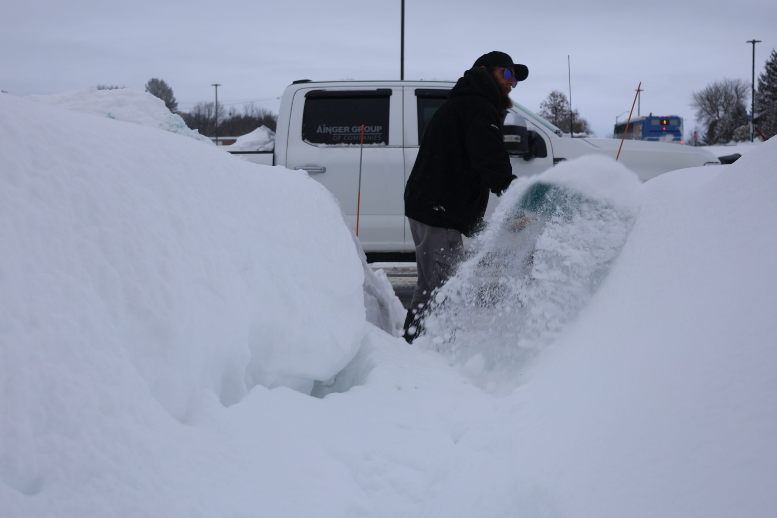Ainger Snow Removal crew clearing deep snow for a commercial property in Collingwood