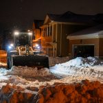 now removal equipment clearing a street during winter parking restrictions