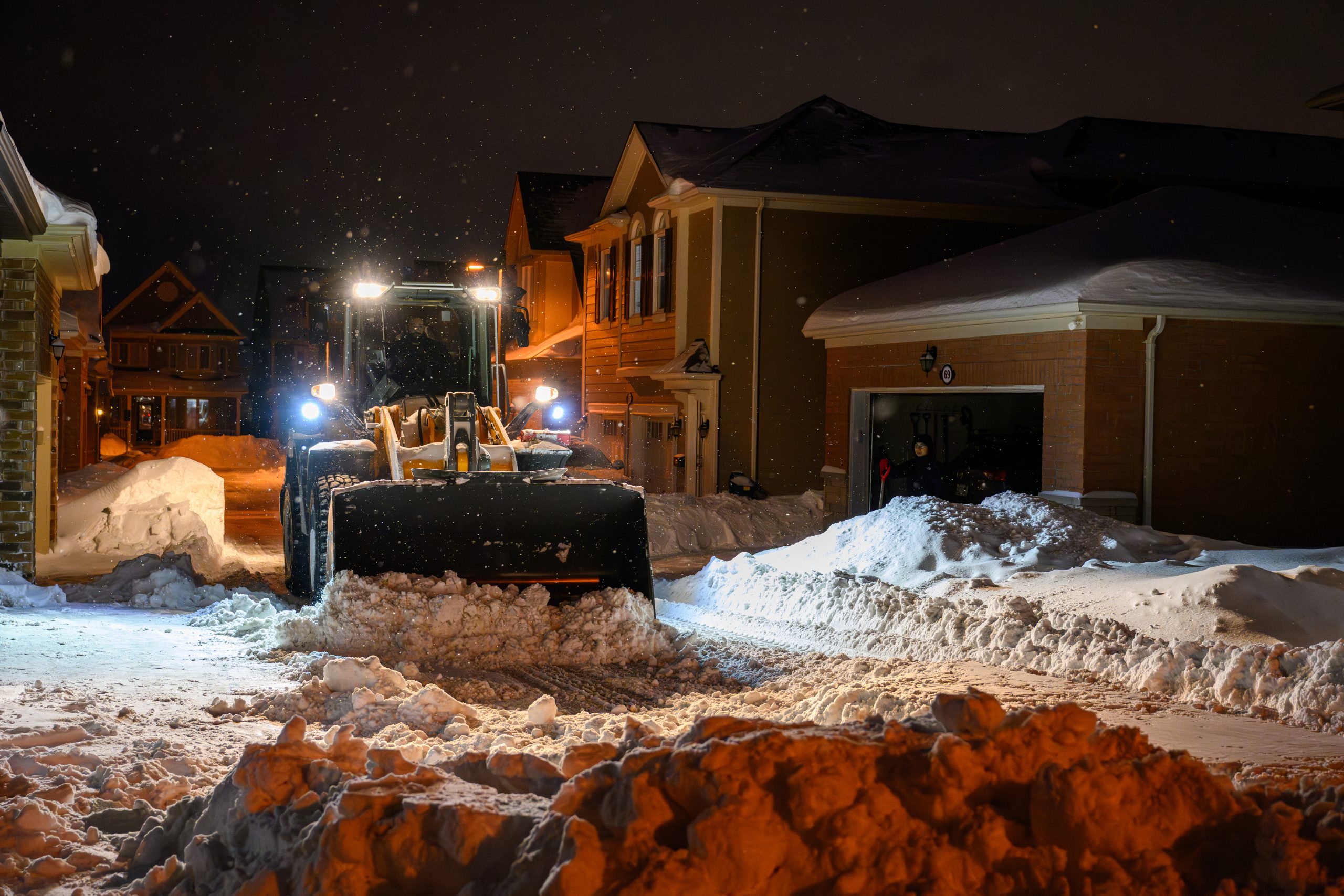 now removal equipment clearing a street during winter parking restrictions