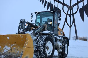 Commercial snow loader equipment working during winter in Barrie Ontario