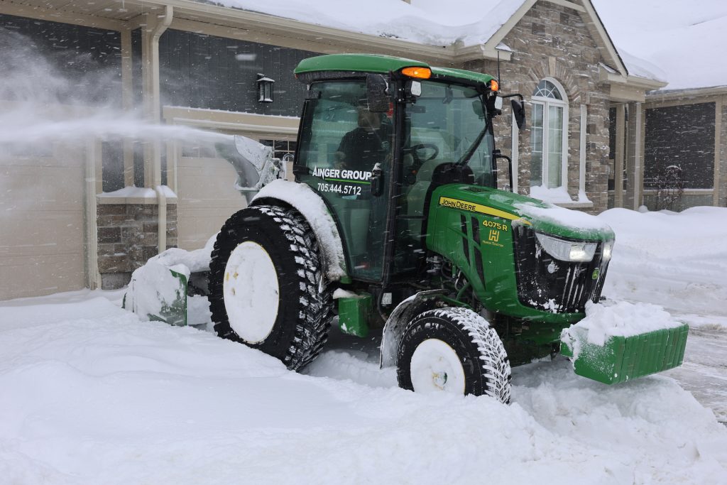Ainger commercial snow clearing equipment working in Collingwood Ontario