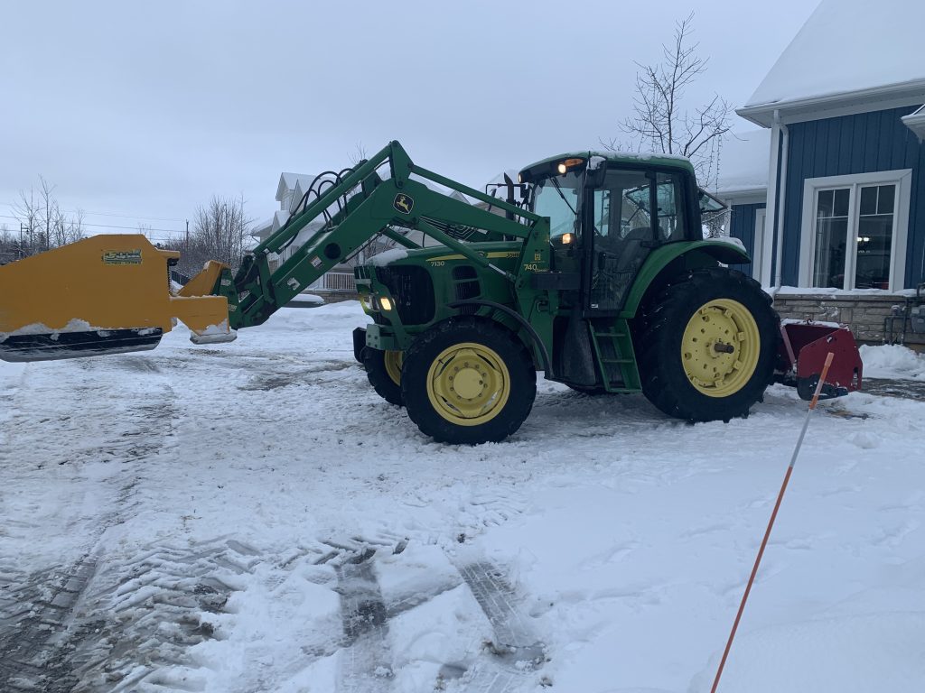 Residential driveway snow clearing equipment working in Collingwood Ontario