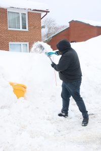Commercial snow clearing around a property feature in Collingwood Ontario